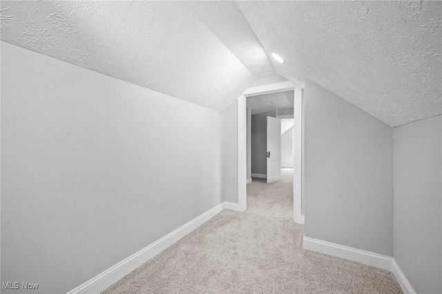 4394 W 139th St, Cleveland, OH 44135 - bonus room featuring a textured ceiling, light colored carpet, baseboards, and lofted ceiling