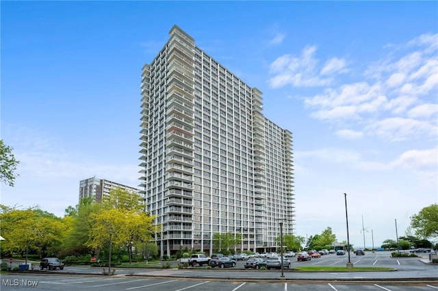view of property featuring uncovered parking