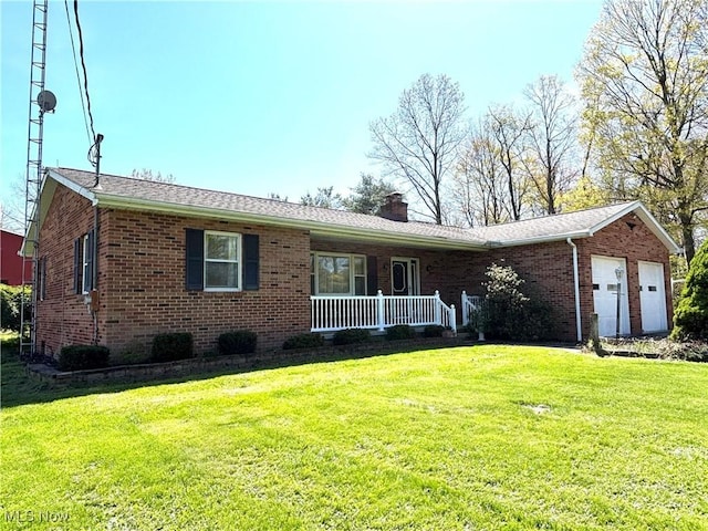 single story home with a garage, covered porch, a front yard, a chimney, and brick siding