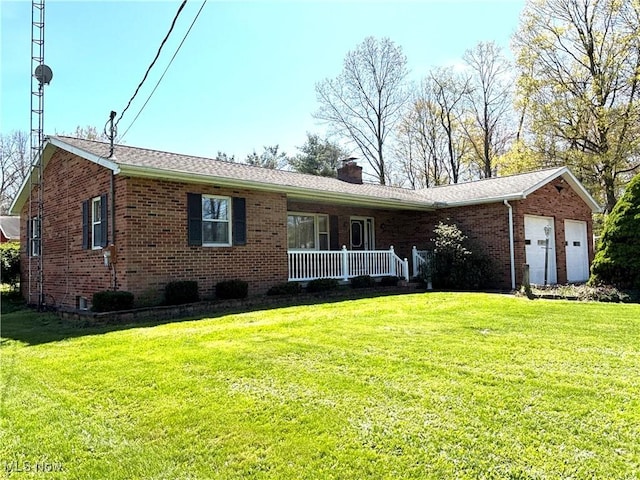 ranch-style home with brick siding, an attached garage, a chimney, and a front lawn