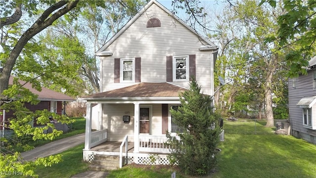 view of front of home featuring a front lawn and covered porch