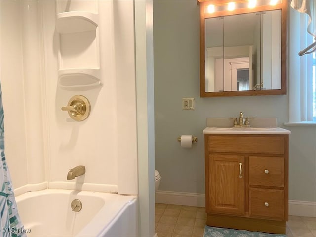 full bath featuring vanity, toilet, tile patterned floors, shower / bath combination with curtain, and baseboards