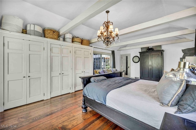 bedroom featuring lofted ceiling with beams, wood-type flooring, and a chandelier