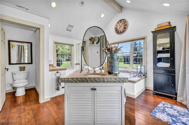 bathroom with wood-type flooring, recessed lighting, visible vents, and vaulted ceiling with beams