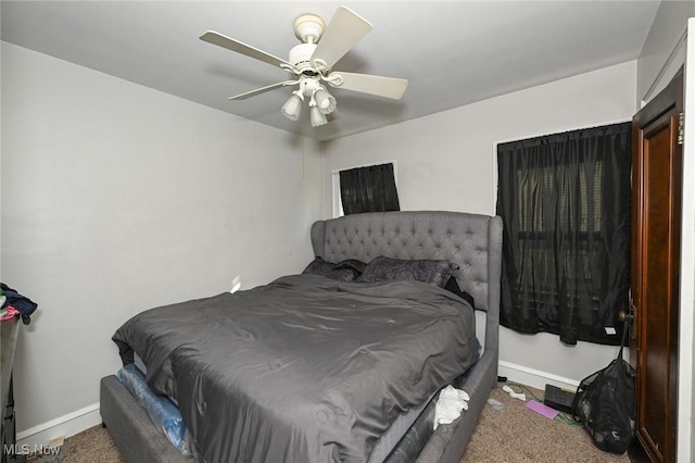 bedroom featuring baseboards, a ceiling fan, and carpet