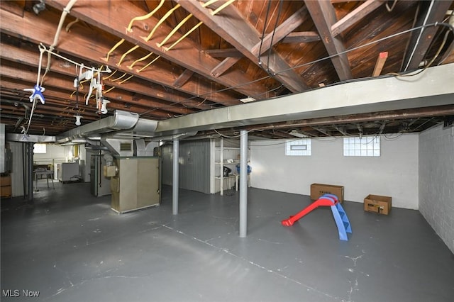 below grade area with washer and clothes dryer