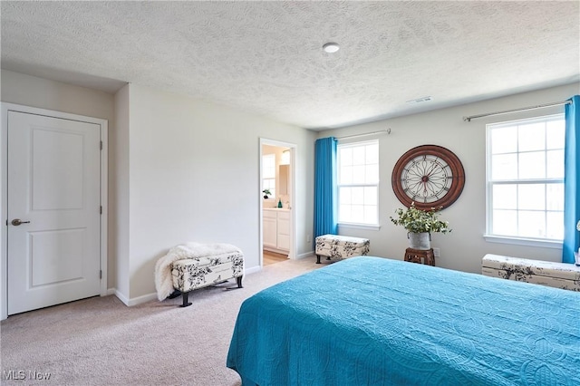 1662 N Eckert Ln, Akron, OH 44313 - bedroom featuring carpet floors, a textured ceiling, visible vents, baseboards, and ensuite bath
