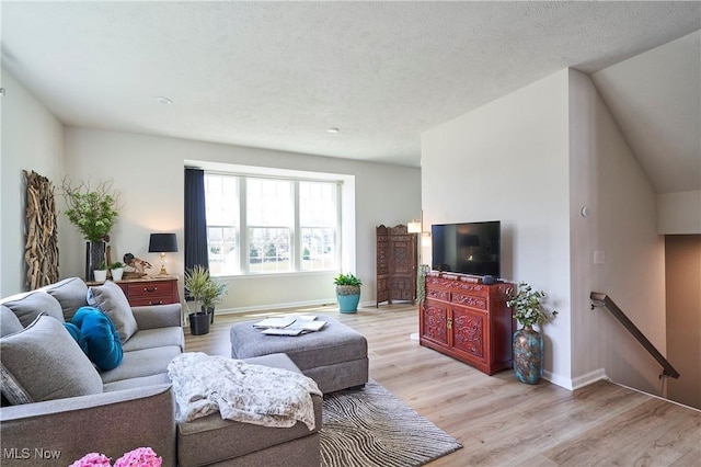 1662 N Eckert Ln, Akron, OH 44313 - living room featuring light wood-style flooring and baseboards