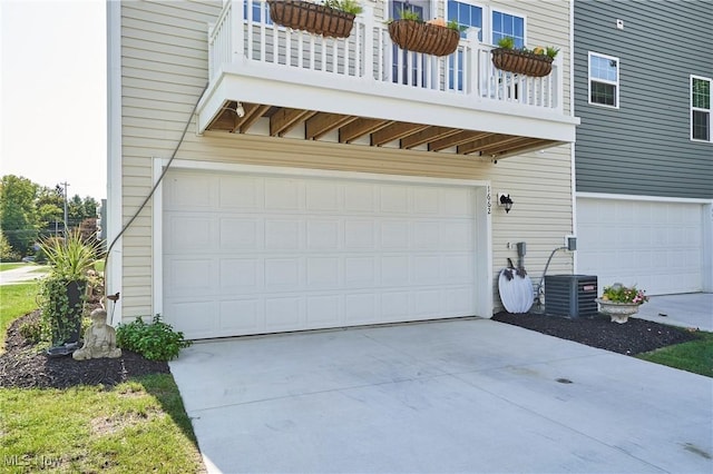 1662 N Eckert Ln, Akron, OH 44313 - garage featuring central AC unit and driveway