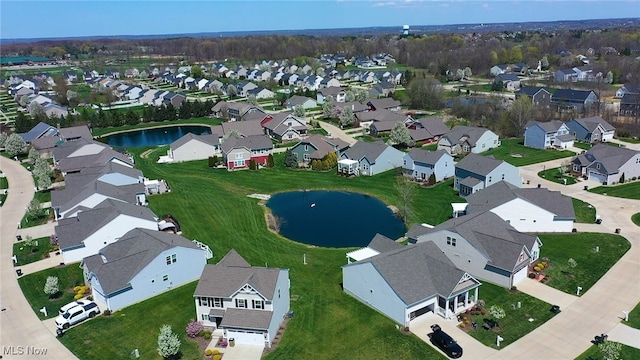 aerial view featuring a residential view and a water view