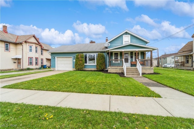 view of front of home featuring an attached garage, a front yard, a chimney, covered porch, and driveway