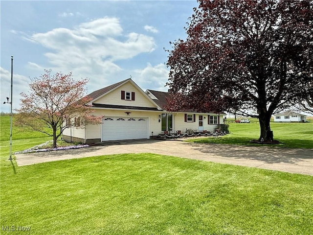 view of front facade featuring an attached garage, aphalt driveway, and a front yard