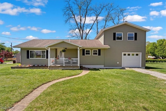 view of front of home featuring a garage, a front yard, covered porch, and gravel driveway