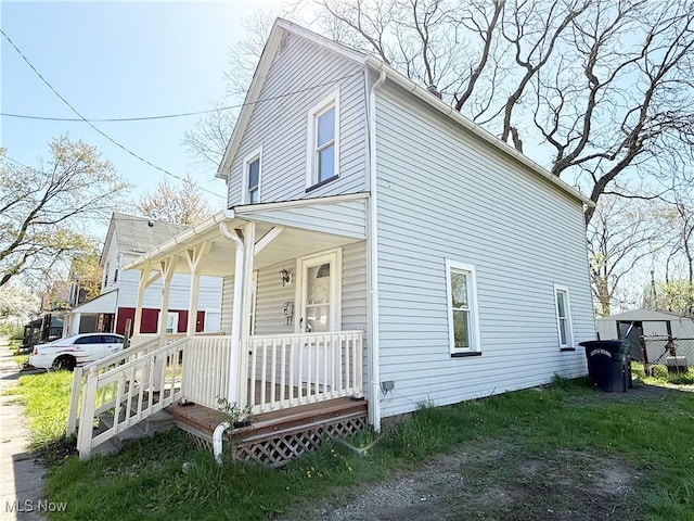 view of side of home featuring a porch