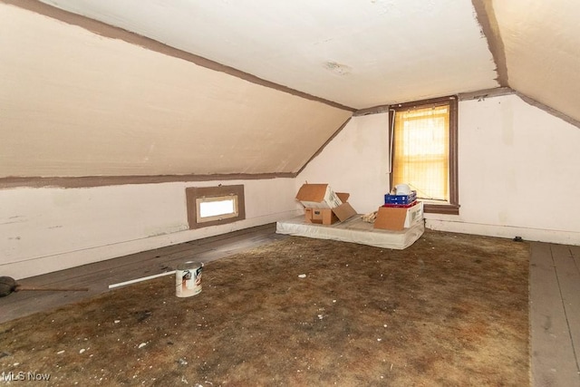 bonus room with vaulted ceiling and a wealth of natural light
