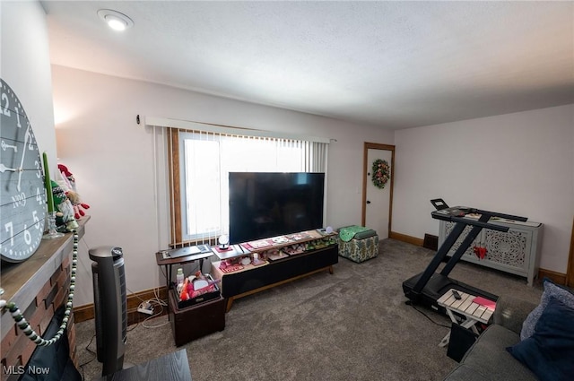 carpeted living room with baseboards