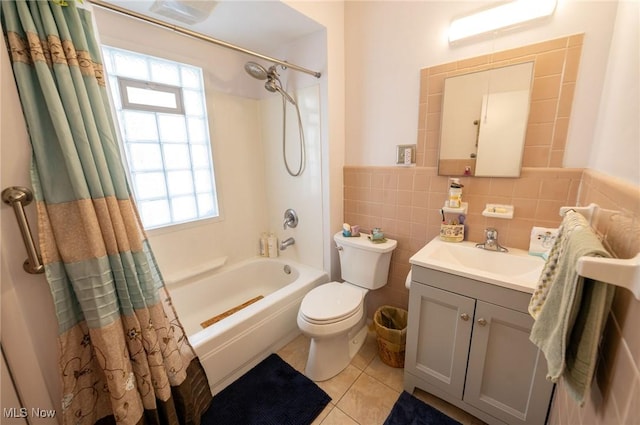 bathroom featuring shower / tub combo with curtain, tile patterned floors, a wealth of natural light, and toilet