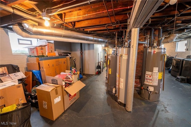 basement with separate washer and dryer and water heater