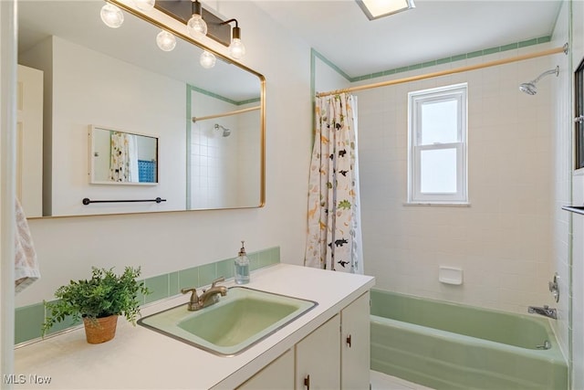 full bathroom with shower / bath combo and vanity