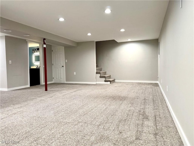 finished basement featuring carpet floors, recessed lighting, and baseboards
