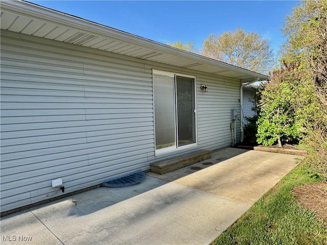 entrance to property featuring a patio