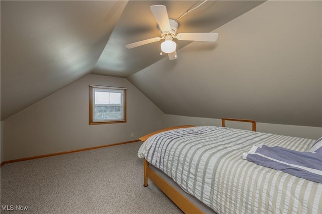 bedroom with carpet floors, baseboards, vaulted ceiling, and ceiling fan