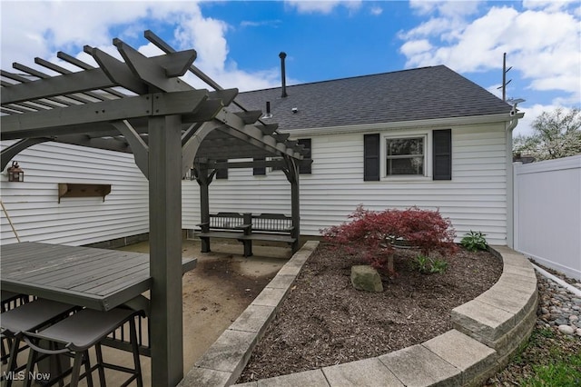 view of patio featuring fence and a pergola