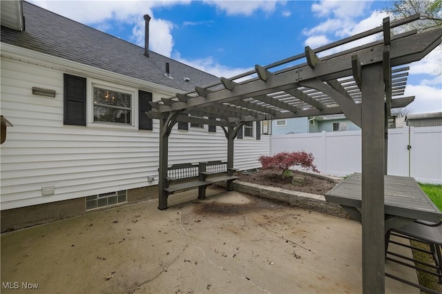 view of patio / terrace with a pergola and fence
