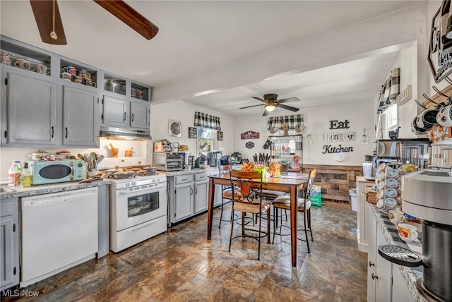 kitchen featuring gray cabinetry, a ceiling fan, under cabinet range hood, and white appliances