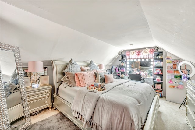 carpeted bedroom with vaulted ceiling