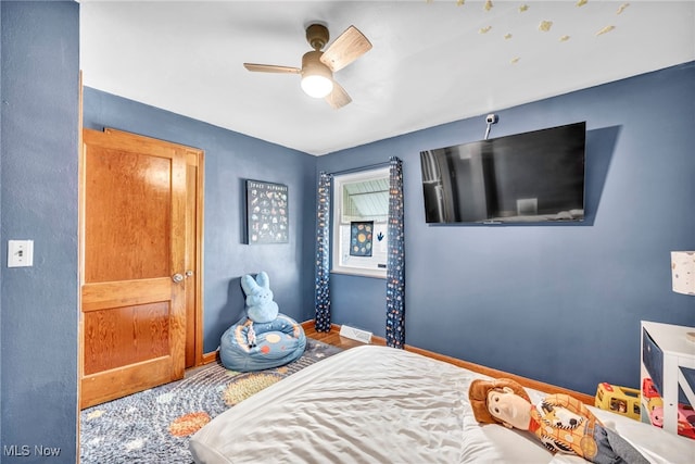 bedroom with baseboards and ceiling fan
