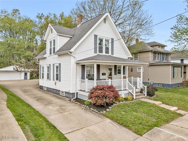 bungalow-style home featuring an outdoor structure, covered porch, a chimney, a shingled roof, and a detached garage