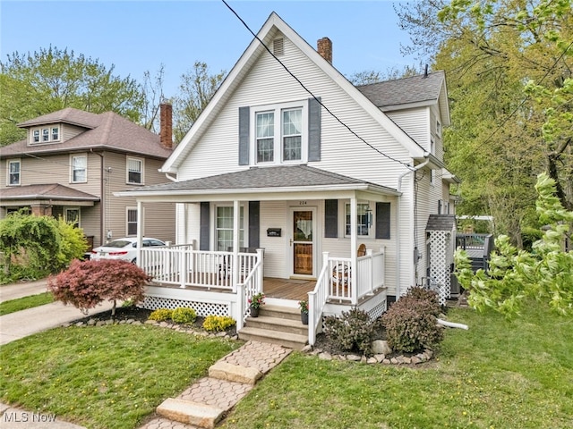 bungalow-style home with a porch, a shingled roof, a front lawn, and a chimney