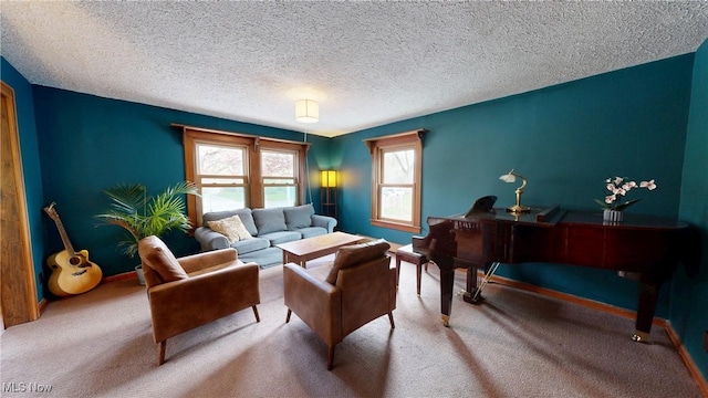 carpeted living room with baseboards and a textured ceiling