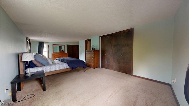 carpeted bedroom with baseboards and two closets