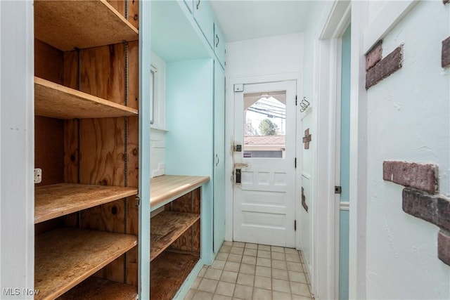 mudroom with light tile patterned floors