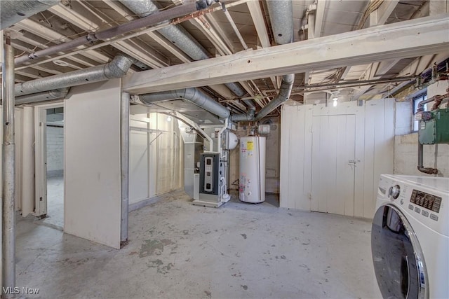 unfinished basement with heating unit, gas water heater, and washer / clothes dryer