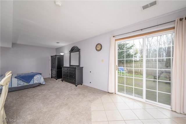 unfurnished bedroom with access to outside, visible vents, and light colored carpet