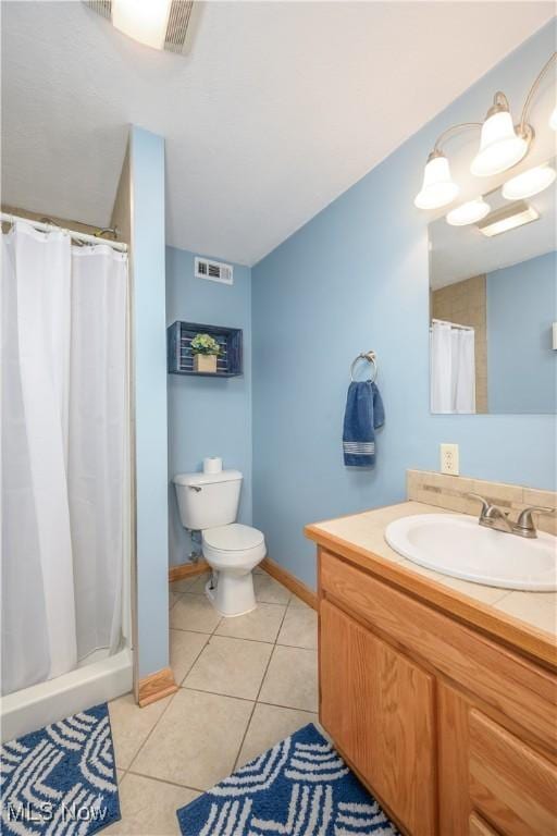 bathroom with visible vents, tile patterned floors, toilet, and curtained shower