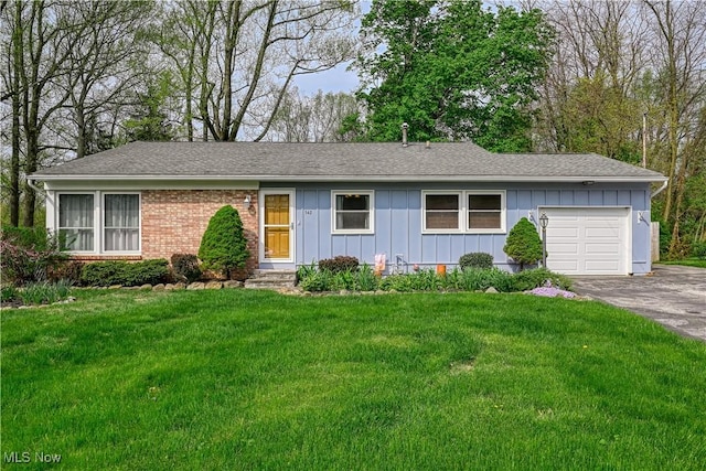 single story home with a garage, board and batten siding, a front yard, and aphalt driveway