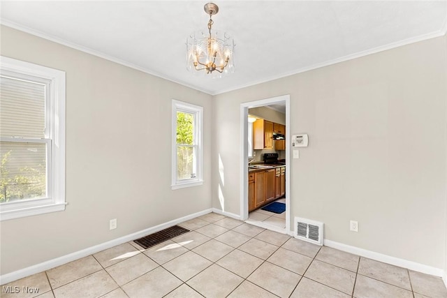 unfurnished dining area with baseboards, a chandelier, and visible vents