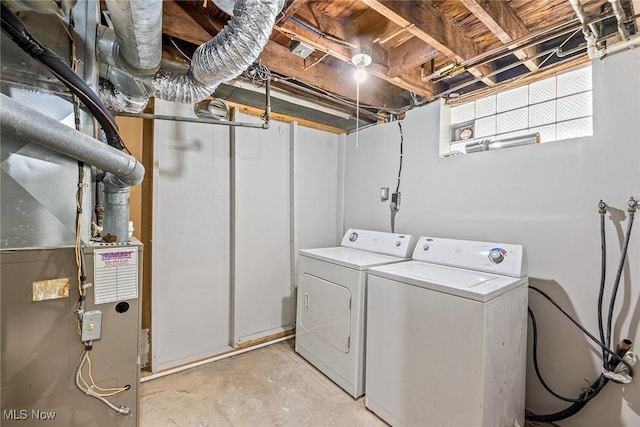 laundry area featuring separate washer and dryer, laundry area, and heating unit