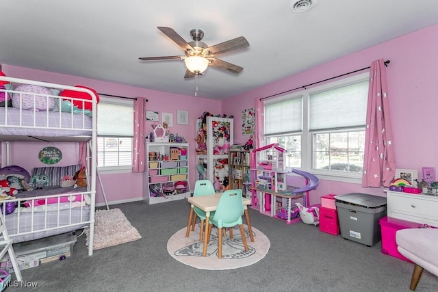 bedroom with visible vents, carpet floors, multiple windows, and ceiling fan