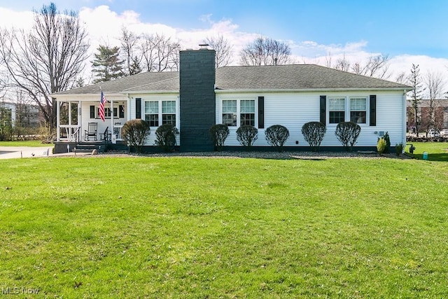 single story home with a chimney, a porch, and a front lawn