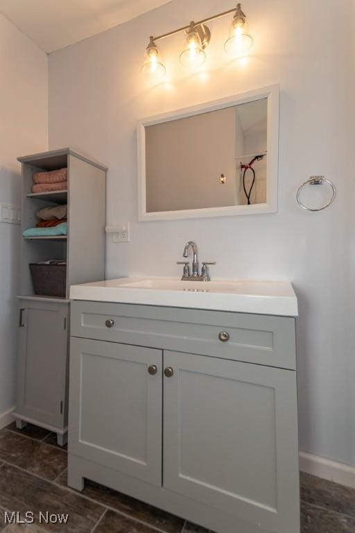 bathroom featuring vanity and baseboards