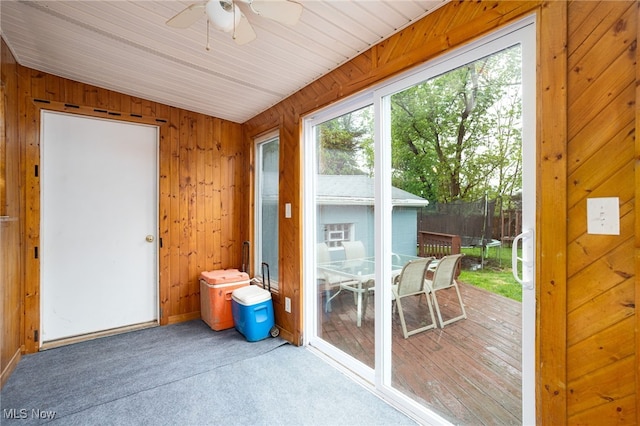 326 N Lyman St, Wadsworth, OH 44281 - doorway with carpet flooring, wooden walls, and a ceiling fan