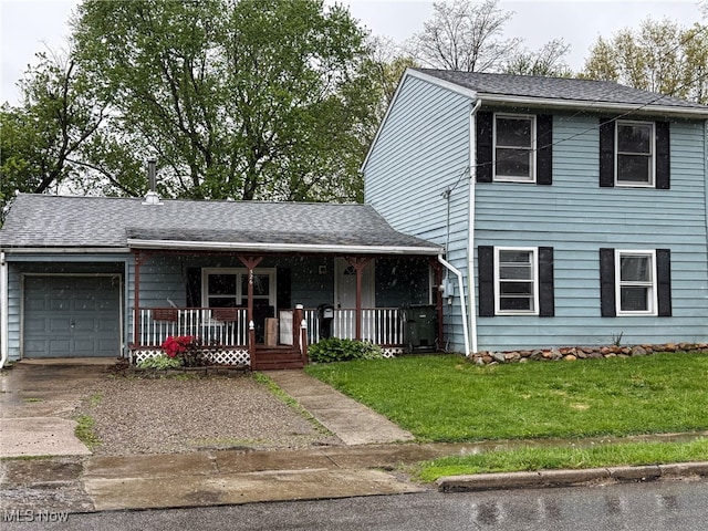 326 N Lyman St, Wadsworth, OH 44281 - view of front of house with a porch, roof with shingles, concrete driveway, a garage, and a front lawn