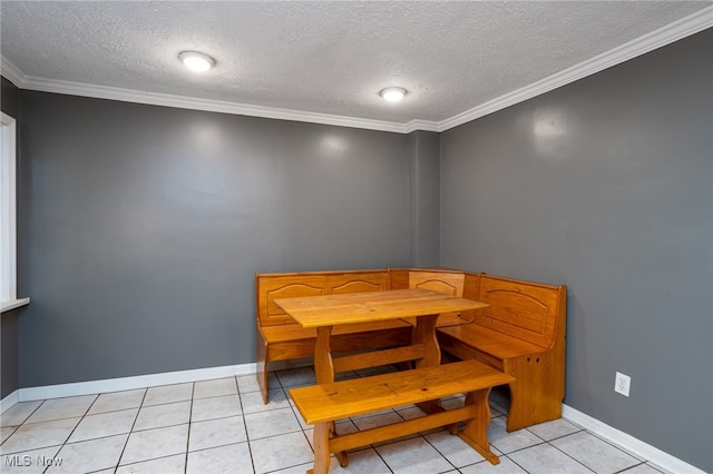 326 N Lyman St, Wadsworth, OH 44281 - dining room featuring baseboards, light tile patterned flooring, crown molding, and a textured ceiling