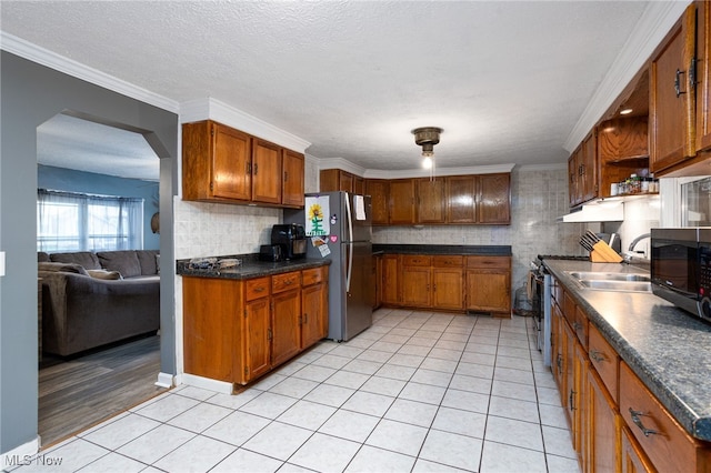 326 N Lyman St, Wadsworth, OH 44281 - kitchen featuring brown cabinetry, stainless steel appliances, and a sink