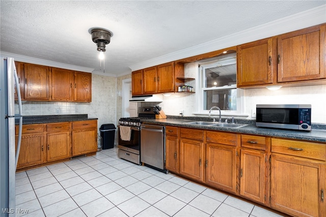 326 N Lyman St, Wadsworth, OH 44281 - kitchen featuring a sink, open shelves, brown cabinetry, backsplash, and appliances with stainless steel finishes